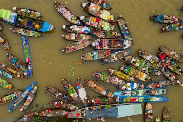 Traditional floating market in Mekong Delta